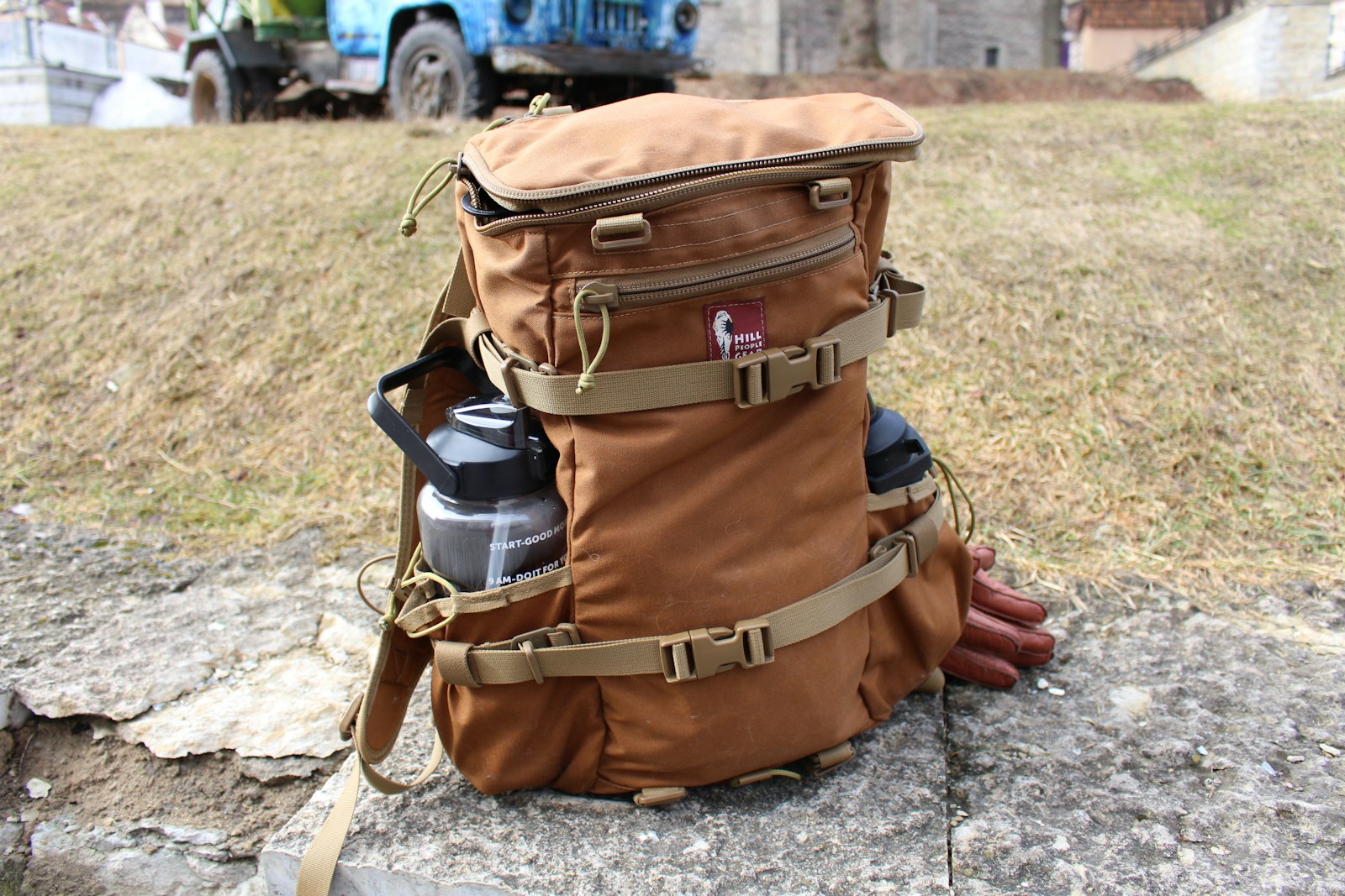 Photo by Ralf Sauter a brown backpack sitting on top of a rock