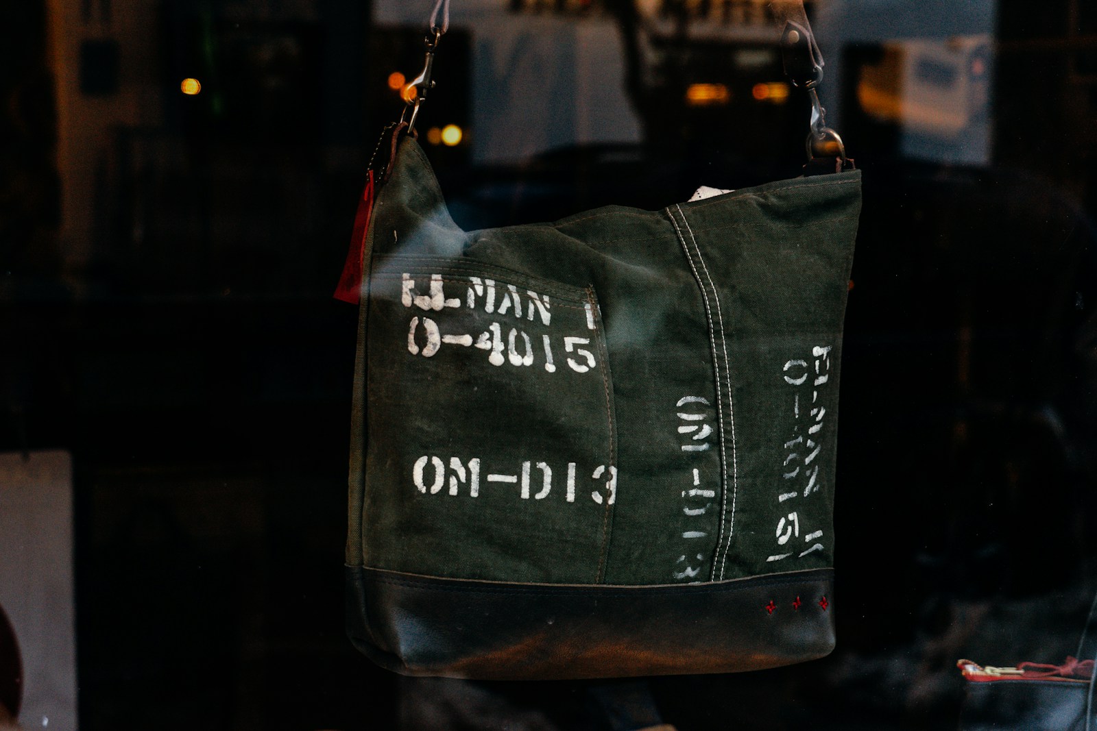 Photo by Jay Nlper black and green tote bag