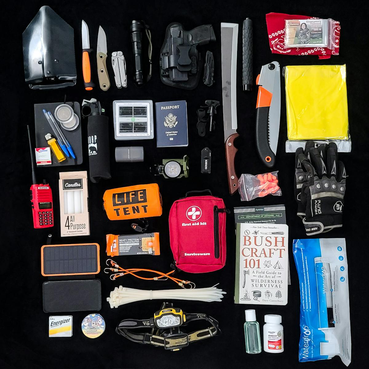 Photo by Anthony Acosta Survival gear essentials arranged as a flat lay for camping and hiking preparedness.