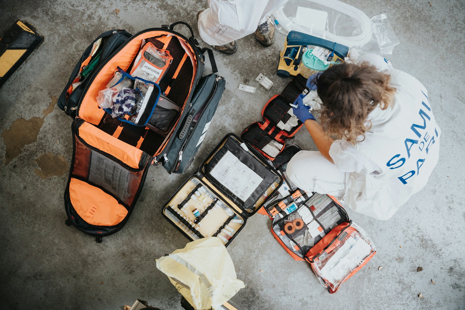 Photo by Mathurin NAPOLY / matnapo boy in white shirt sitting on orange and black backpack