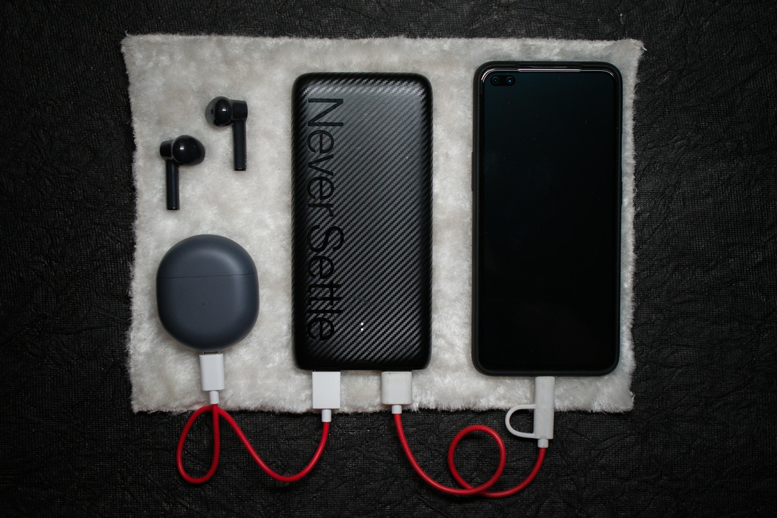 Photo by Atharva Whaval black iphone 5 c beside white usb cable