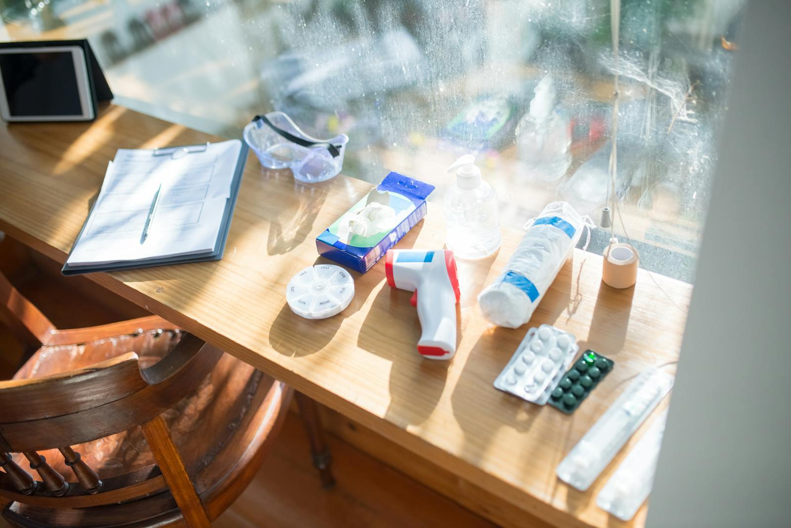 Photo by Kampus Production A sunlit desk with medical supplies and a clipboard, perfect for home healthcare concepts.